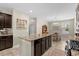 Modern kitchen featuring a central island with granite countertops, stainless steel appliances, and open layout at 3110 Bramble Glen Dr., Myrtle Beach, SC 29579