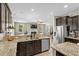 Gourmet kitchen boasts stainless appliances, granite counters, and open floor plan at 3110 Bramble Glen Dr., Myrtle Beach, SC 29579