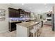 A bright kitchen featuring granite countertops, stainless appliances, and a large island at 3110 Bramble Glen Dr., Myrtle Beach, SC 29579