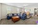 Living room featuring a large blue sectional sofa, neutral walls, and carpet at 3110 Bramble Glen Dr., Myrtle Beach, SC 29579
