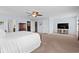 Bright main bedroom featuring large windows, carpeted floor, and a ceiling fan at 3110 Bramble Glen Dr., Myrtle Beach, SC 29579