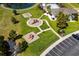 Aerial view of a community playground, parking and green spaces near a lake at 3110 Bramble Glen Dr., Myrtle Beach, SC 29579