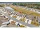Community aerial showcasing landscaping, ponds, and well-maintained homes at 328 Logan St., Little River, SC 29566