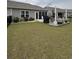 Well-maintained backyard featuring a patio with a grill and ample green space at 328 Logan St., Little River, SC 29566