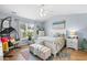 Inviting bedroom with a ceiling fan, plenty of natural light, and coastal decor at 328 Logan St., Little River, SC 29566
