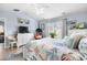 Comfortable bedroom with a starfish themed quilt, a ceiling fan, and ample natural light at 328 Logan St., Little River, SC 29566