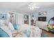 Cozy bedroom featuring a ceiling fan, nautical themed bedding, and coastal decor at 328 Logan St., Little River, SC 29566