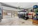 Spacious garage with a golf cart, tools, and plenty of storage space at 328 Logan St., Little River, SC 29566