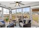 Relaxing sunroom with views of the backyard, comfortable seating, and plenty of natural light at 328 Logan St., Little River, SC 29566