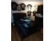 Cozy bedroom featuring dark furniture and unique wall decor at 4011 Southern Cross Rd., Myrtle Beach, SC 29579