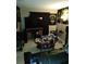 Comfortable living room featuring a dark leather sofa and entertainment center at 4011 Southern Cross Rd., Myrtle Beach, SC 29579