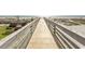 Beach access with a long wooden walkway leading to the ocean at 6804 Ocean Blvd. N # 625, Myrtle Beach, SC 29572