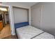 Cozy bedroom with an open door to the kitchen and a twin bed featuring a pristine white mattress at 6804 Ocean Blvd. N # 625, Myrtle Beach, SC 29572