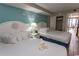 Bright bedroom with two double beds, ocean themed decor, and a private balcony at 6804 Ocean Blvd. N # 625, Myrtle Beach, SC 29572