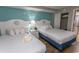 Inviting bedroom featuring two beds with white linens, cute nautical decor, closet and tile floor at 6804 Ocean Blvd. N # 625, Myrtle Beach, SC 29572