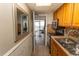 Updated kitchenette features stainless appliances, stone countertops, and access to private balcony at 6804 Ocean Blvd. N # 625, Myrtle Beach, SC 29572