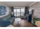 Comfortable living room featuring a balcony overlooking the ocean with stylish, beachy accents and decor at 6804 Ocean Blvd. N # 625, Myrtle Beach, SC 29572