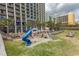 Exterior view of outdoor playground and splashpad surrounded by resort buildings and lounge chairs at 6804 Ocean Blvd. N # 625, Myrtle Beach, SC 29572