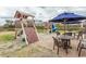Outdoor playground area featuring a play structure, picnic tables, and shade umbrellas at 6804 Ocean Blvd. N # 625, Myrtle Beach, SC 29572