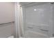 Clean and well-maintained shower with white enclosure, shower curtain, and tiled walls at 6804 Ocean Blvd. N # 625, Myrtle Beach, SC 29572