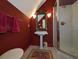This cozy bathroom boasts a pedestal sink, bright lighting, and a glass-enclosed shower at 710 Masters Dr., Pawleys Island, SC 29585