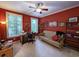 A home office showcasing a futon, desk, and shelving for storage and style at 710 Masters Dr., Pawleys Island, SC 29585
