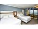 Cozy bedroom with two queen beds and a private balcony overlooking the ocean at 7100 N Ocean Blvd. # 405, Myrtle Beach, SC 29572