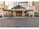 Hotel entrance with glass doors and an awning over a pick-up/drop-off area at 7100 N Ocean Blvd. # 405, Myrtle Beach, SC 29572