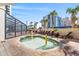 Hot tub area with lounge chairs, palm trees, and views of the surrounding buildings at 7100 N Ocean Blvd. # 405, Myrtle Beach, SC 29572