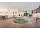 Relaxing indoor hot tub area with tables, chairs, and large windows for natural light at 7100 N Ocean Blvd. # 405, Myrtle Beach, SC 29572