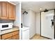 Convenient kitchenette features wood cabinets, granite countertops, a microwave and mini refrigerator at 7100 N Ocean Blvd. # 405, Myrtle Beach, SC 29572