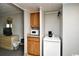 Functional kitchenette with wood cabinets, granite countertops, microwave, mini fridge, and coffee maker at 7100 N Ocean Blvd. # 405, Myrtle Beach, SC 29572