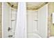 Shower with a white shower curtain and built in shower caddy for storing toiletries at 7100 N Ocean Blvd. # 405, Myrtle Beach, SC 29572