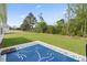 Large grass backyard with neighboring houses and wooded perimeter at 742 Woodside Dr., Conway, SC 29526