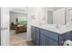 Bathroom vanity with double sinks and a view of the bedroom at 742 Woodside Dr., Conway, SC 29526