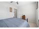 Bedroom with blue bedding, side table, and two closets at 742 Woodside Dr., Conway, SC 29526