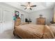Bedroom features a four-poster bed, ceiling fan, and carpeted floors at 742 Woodside Dr., Conway, SC 29526