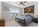 Bedroom features a large window, ceiling fan, carpeted floor, and tapestry at 742 Woodside Dr., Conway, SC 29526