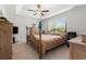 Cozy bedroom with a four-poster bed, neutral carpet, and ceiling fan at 742 Woodside Dr., Conway, SC 29526