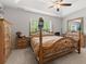 Bright bedroom with a four-poster bed, ceiling fan, and natural light at 742 Woodside Dr., Conway, SC 29526