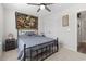 Bedroom features a large window, ceiling fan, tapestry, and closet at 742 Woodside Dr., Conway, SC 29526