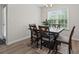 Dining room with modern table and chairs illuminated by natural light from a window at 742 Woodside Dr., Conway, SC 29526