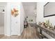 Inviting foyer with hardwood floors, neutral walls, and a decorative wreath on the front door at 742 Woodside Dr., Conway, SC 29526