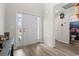 Bright foyer with hardwood floors, white door and door frame, and view into an adjacent bathroom at 742 Woodside Dr., Conway, SC 29526