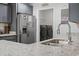 Bright kitchen with stainless steel appliances, granite countertops, and washer/dryer at 742 Woodside Dr., Conway, SC 29526
