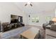 Cozy living room featuring a plush rug, modern decor, and large window for natural light at 742 Woodside Dr., Conway, SC 29526