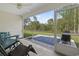 Screened in patio with seating, ceiling fan, and views of green backyard at 742 Woodside Dr., Conway, SC 29526