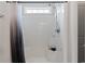 Bathroom shower with a shower curtain, window, and showerhead at 742 Woodside Dr., Conway, SC 29526