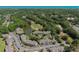 Scenic aerial view of community with pond, golf course, and convenient parking in lush, landscaped setting at 10 Logan Berry Ct. # H, Murrells Inlet, SC 29576