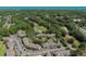Scenic aerial view of community with pond, golf course, and convenient parking in lush, landscaped setting at 10 Logan Berry Ct. # H, Murrells Inlet, SC 29576